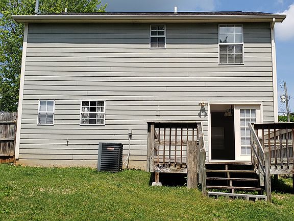 Back of house with deck