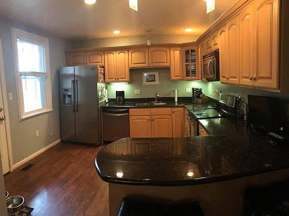 Updated eat-in kitchen with stainless steel appliances and granite counter tops.