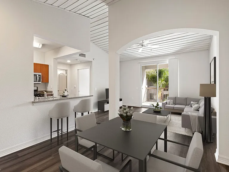 Living room with large floor to ceiling windows and high ceilings