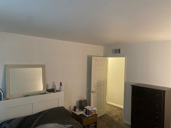 Spacious furnished bedroom with 5 drawer dresser with full size newer mattress Bed frame includes book shelves and storage drawers under the bed frame