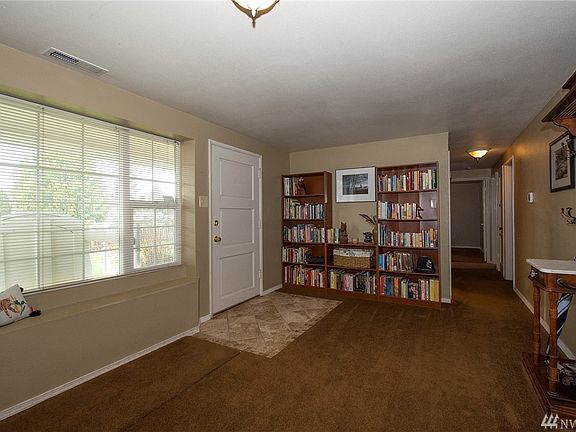 Large window in living room for maximum year around light and convenient window seat