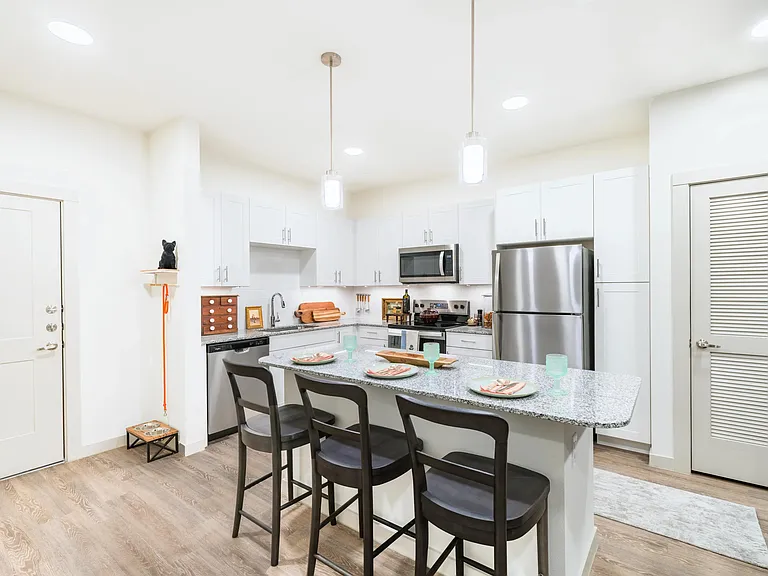 Homes feature gourmet kitchens with granite countertops, large chef's island with built-in storage, and 42-inch custom cabinetry.
