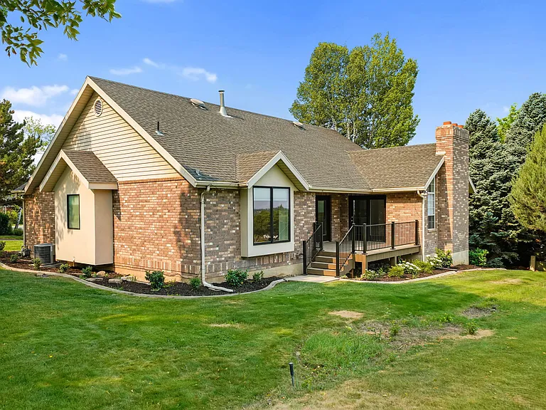 Deck and backyard with open access to expansive park.