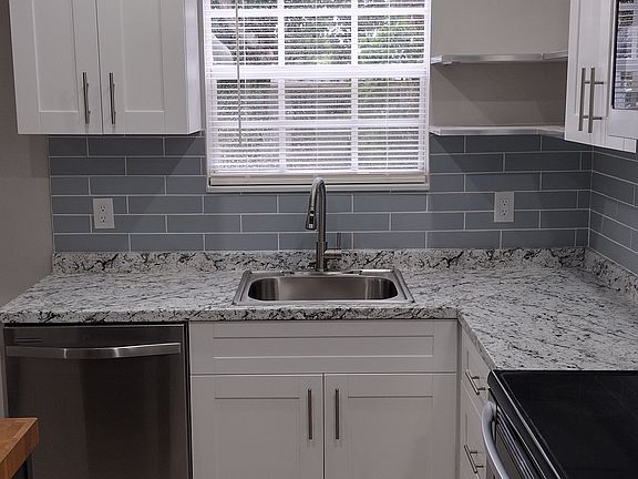 Shaker white kitchen cabinets with center island.
