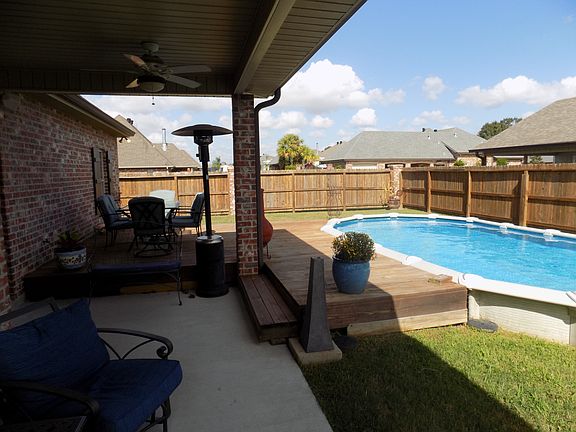 patio and deck near pool