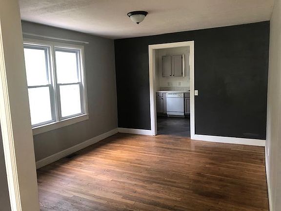 Dining room with current wall colors - gray and charcoal accent wall.