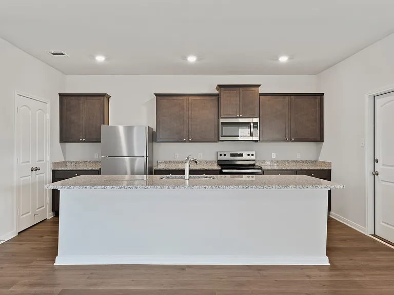 The kitchen has a wonderful kitchen island.
