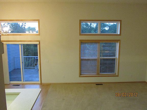 Large windows in kitchen and living room. There is marsh behind the property for added privacy.