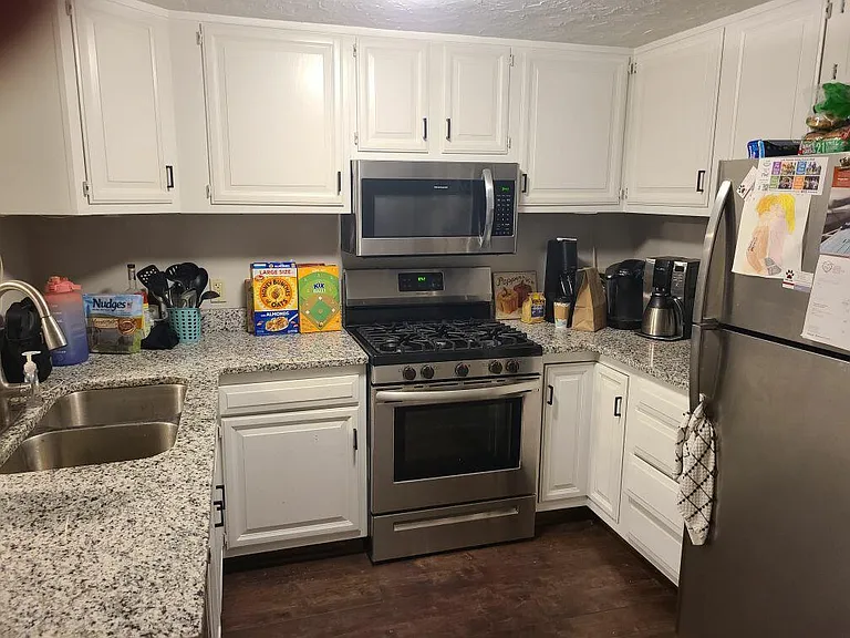 Kitchen with granite countertops and stainless appliances