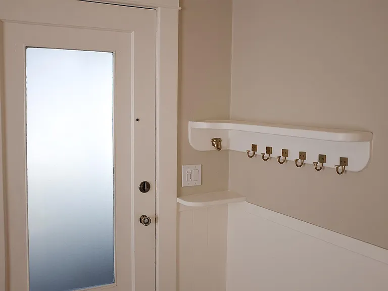 Front door with coat rack and key shelf