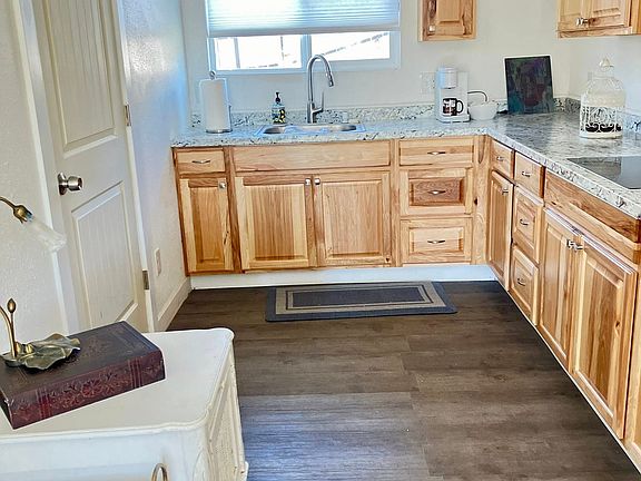 Updated cabinets, floating flooring in Kitchen/Flowing into Living Area