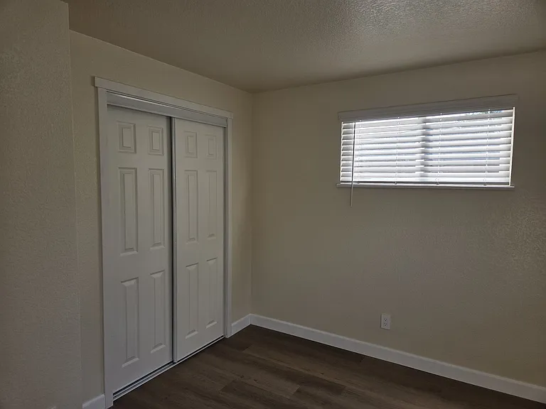 Bedroom 3 with sliding door closet.