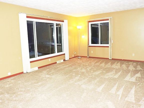 Large family room affords choices for the room layout.  Note the newer replacement windows. 