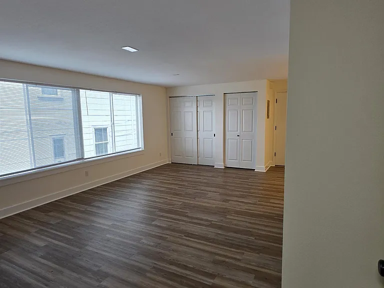 living room from hallway. storage in living room.