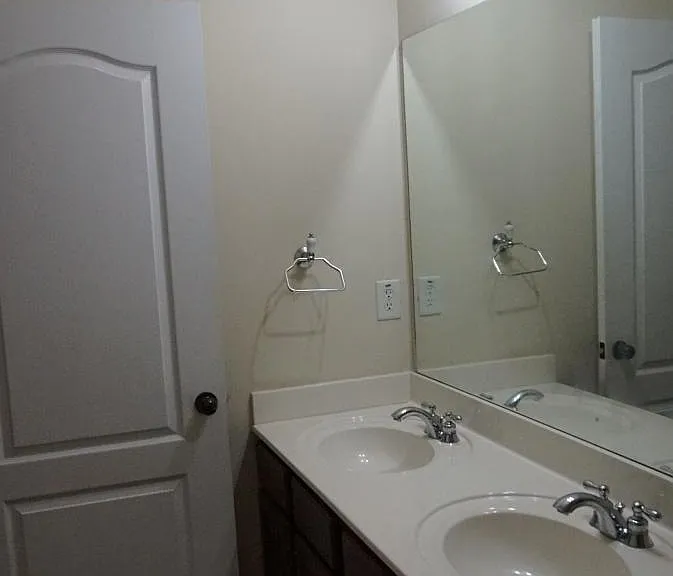 Convenient double vanity in guest/kids' bathroom