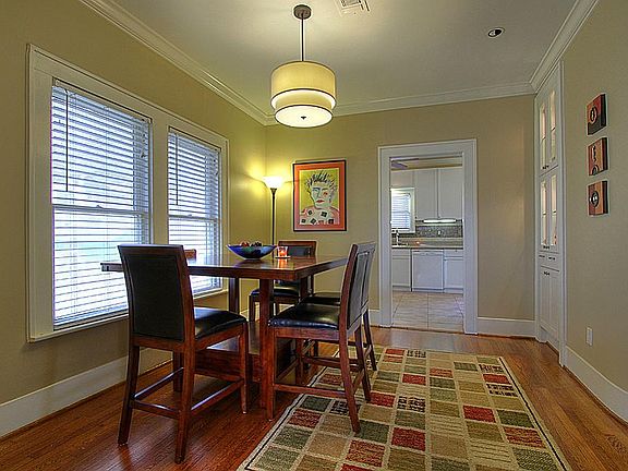 Upstairs Dining Room with decorative light fixture. (Not seen is built-in cabinets with separate lighting)