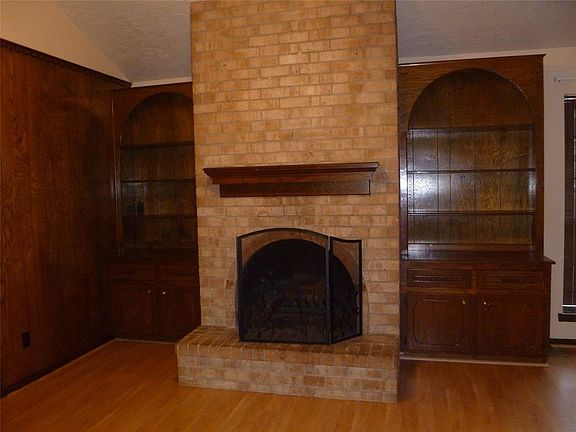 Closer View of Gas Line Fireplace & Built In Bookshelves.