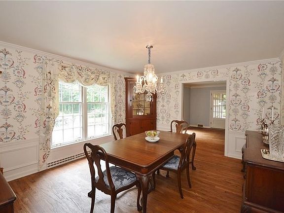 Beautiful moldings in sun-soaked formal dining room