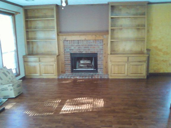 Living room with built-ins and new flooring