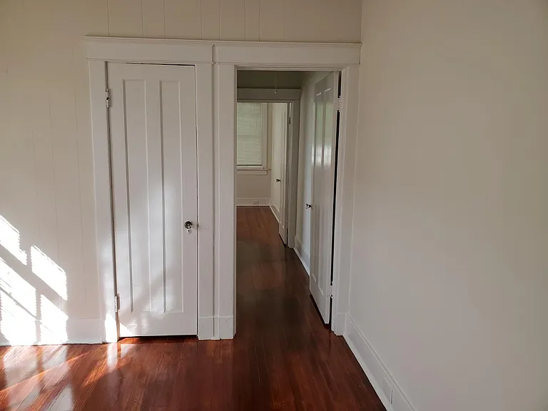 Bedroom View to hallway- bath to the left and another bedroom to the rear