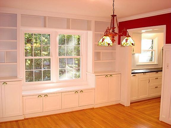 The dining room has built-in cabinets and can seat 12 