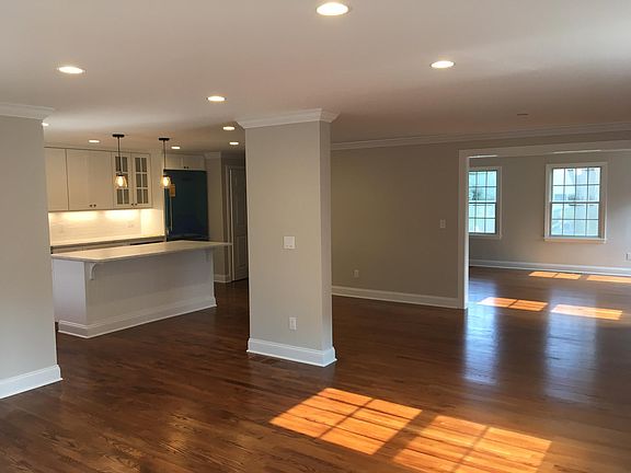 Kitchen with open flow-through to dining room and sun-filled