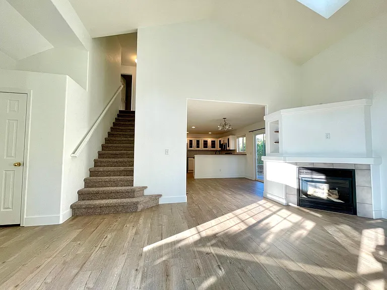 Open living space with site lines from the living room to the kitchen.