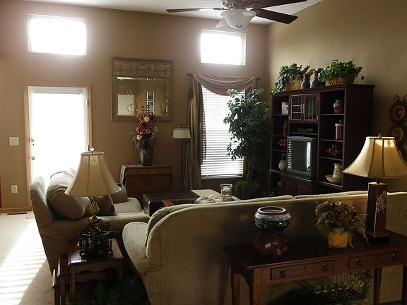 The open inviting family room looks even larger from the high ceilings