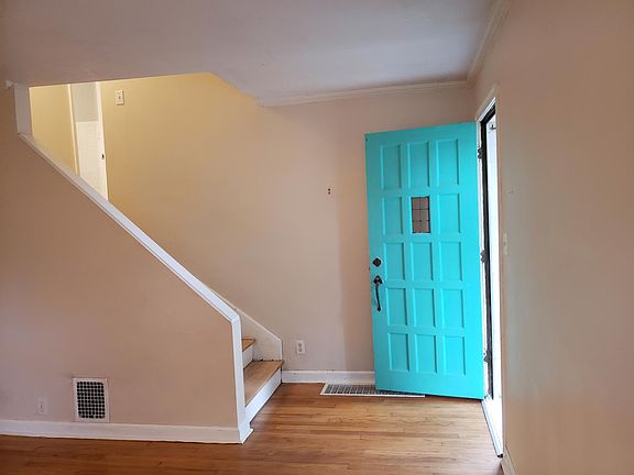 Entry way leading into the living room (or up the stairs to BRs)