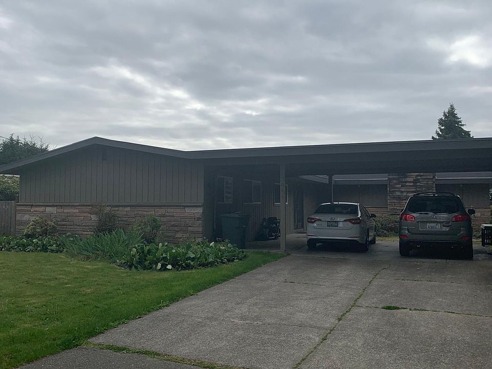 Front of house, 2 vehicle carport with plenty of driveway and street parking.