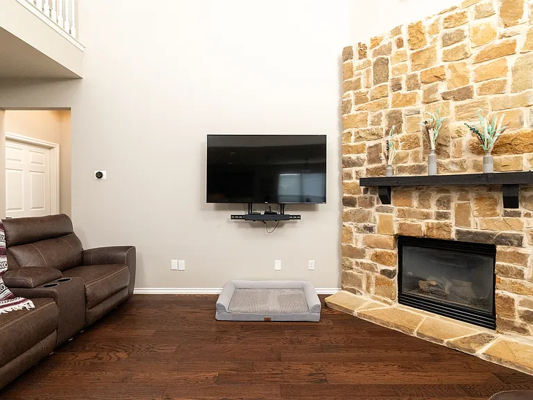 Cozy and welcoming home with a stone fireplace, comfy recliners, smart TV, and plenty of natural light. Perfect for relaxing after exploring the area. Family-friendly, clean, and peaceful.
