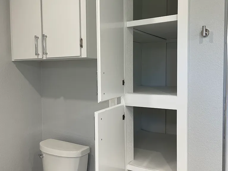 Large linen and storage cabinets.