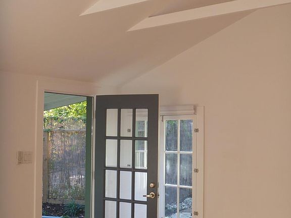 Front door and west wall of living room