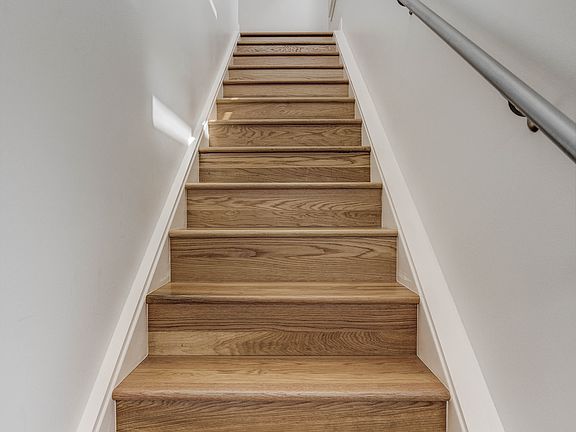 View from doorway, up the oak stairs