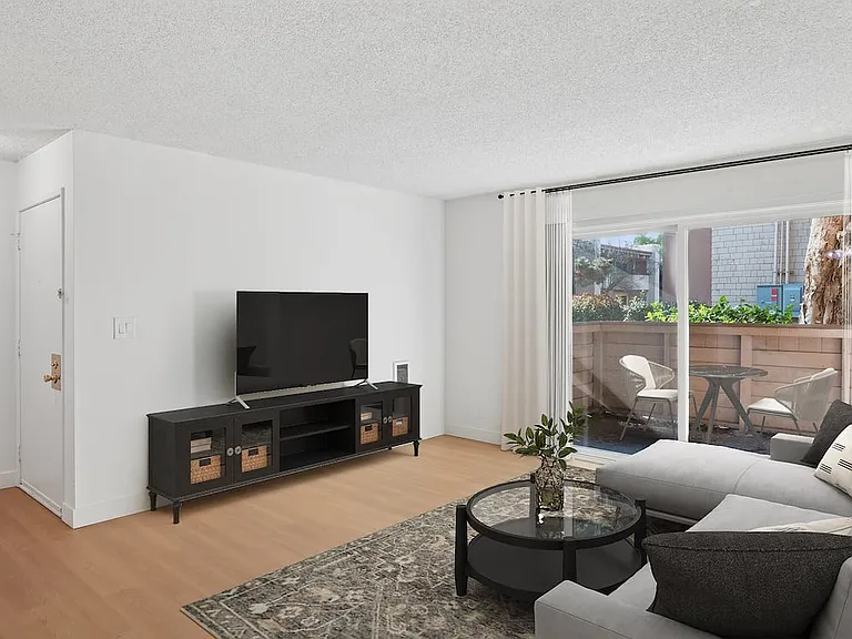 Renovated Package I living room with hard surface flooring