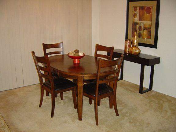 Dining room off kitchen and living room is great for entertaining. Use your table extensions and fit all your family here for those big holiday gatherings!