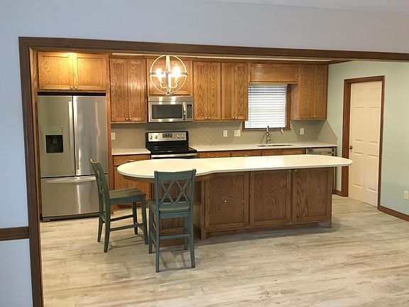 Updated kitchen with stainless steel appliances and corian c