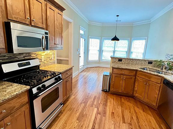 Stainless steel appliances and granite countertops.
