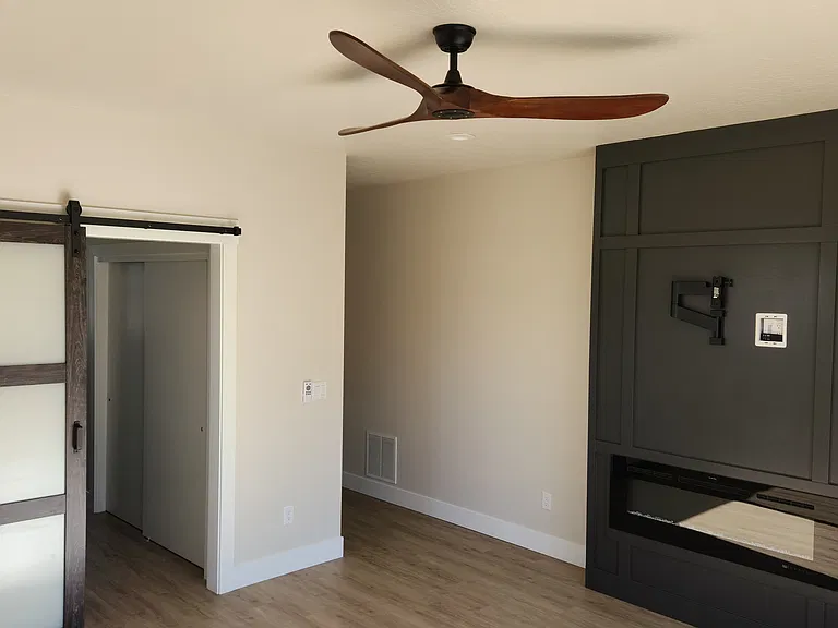 Primary Bedroom - Electric Fireplace and TV Wall