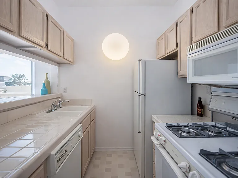 Kitchen with stove/oven dish washer and plenty of cabinetry