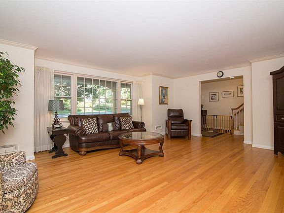 Views out picture window to front porch and yard.