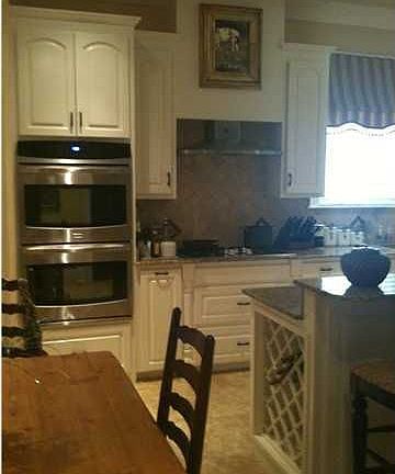 Large family room featuring a ventless fireplace and 10 ft ceilings with lots of natural light