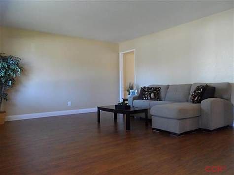 Handscraped laminate flooring in rich warm tones create a neutral palate for your decor. Updated tri