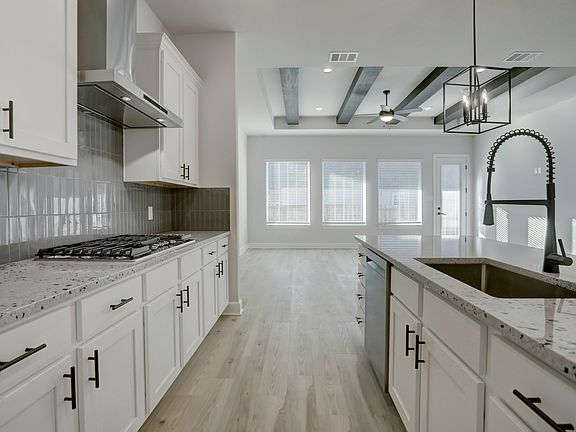 Impressive kitchen with a large island and stainless steel appliances.