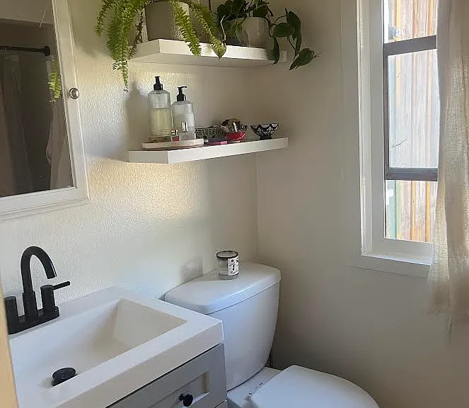 bathroom with full tub and shower