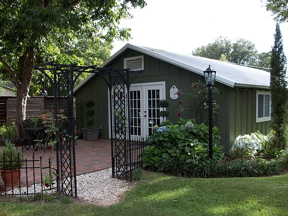 Cottage with brick paver patio
