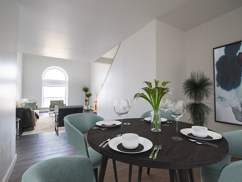 Step into the allure of this timeless apartment building, where a spacious dining room awaits