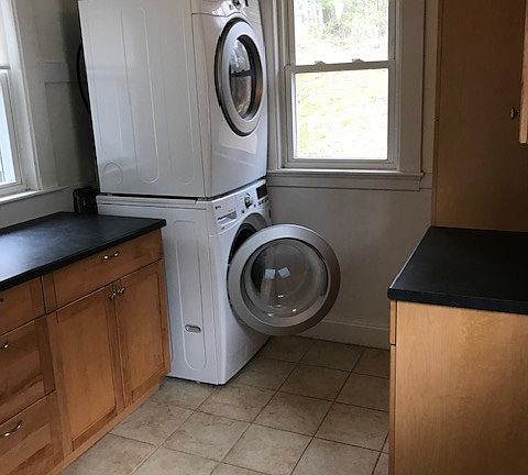 Off of the kitchen is a pantry with a full -size washer and dryer.