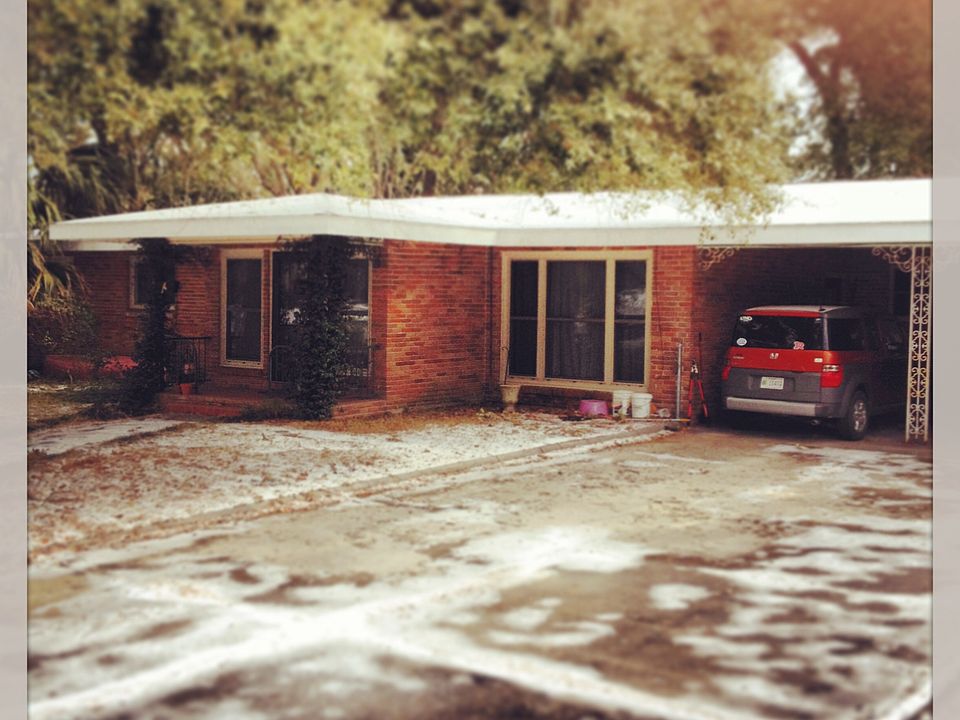 The apartment is to the right of the carport. The apt has a