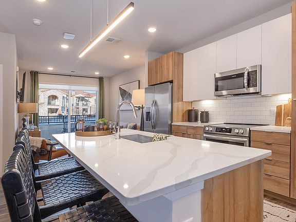 Kitchen with Stainless Steel Appliances and Quartz Countertops